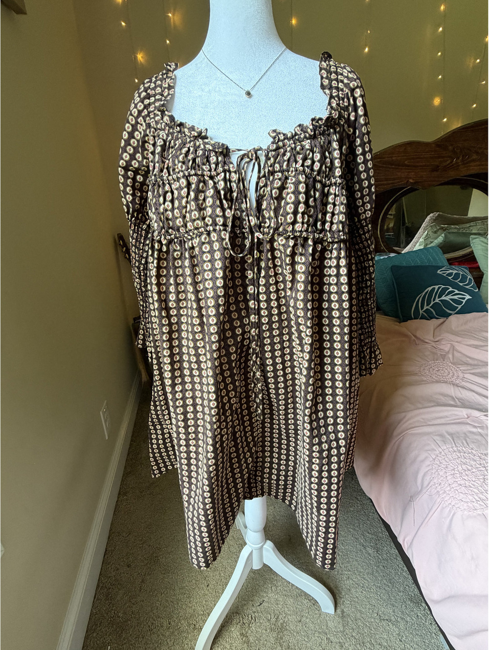 Free People "Star Dip" mini dress in the brown/black geometric circle dot print.